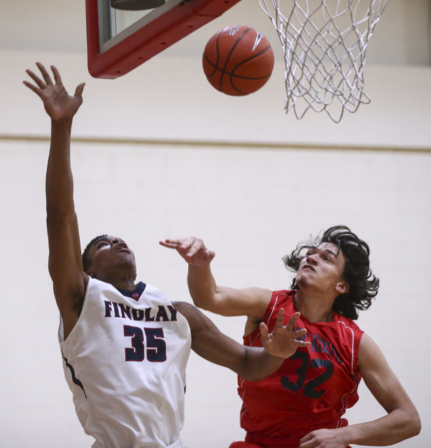 Findlay Prep forward Reggie Chaney (35) attempts a shot as Planet Athlete’s Trevor Iri ...