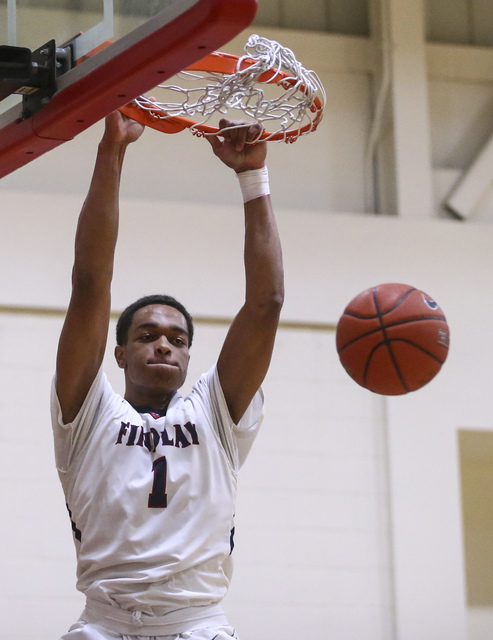 Findlay Prep forward P.J. Washington (1) dunks against Planet Athlete during a basketball ga ...