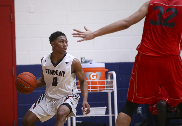Findlay Prep guard Justin Roberts (0) drives the ball against Planet Athlete during a basket ...