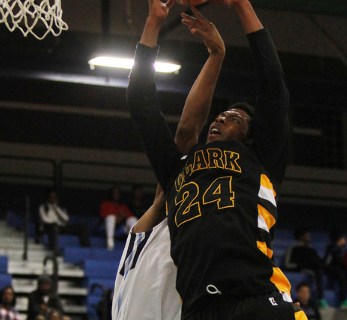 Clark’s Diontae Jones (24) grabs a rebound over Canyon Springs’ Maurice Hunter ( ...