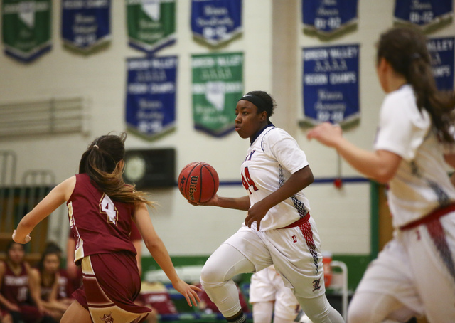 Liberty’s Dre’una Edwards (44) drives to the basket against Downey during the Ga ...