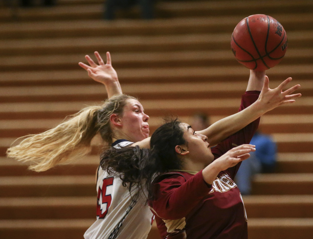 Liberty’s Amanda Pemberton (45) fights for a rebound against Downey’s Lynette Ga ...