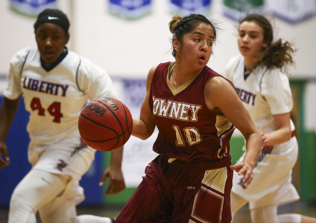 Downey’s Surie Camacho (10) drives against Liberty during the Gator Winter Classic cha ...