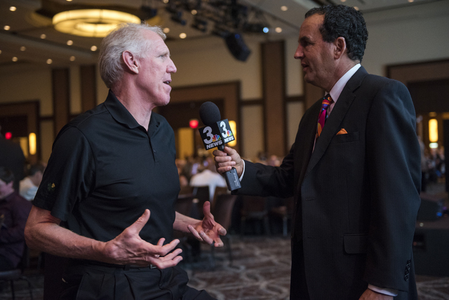 Hall of Fame basketball player Bill Walton, left, is interviewed by channel 3 news weatherma ...