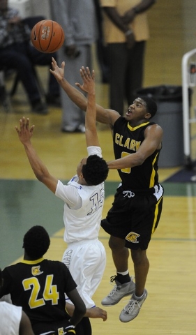 Clark guard Colby Jackson goes up for a layup against Desert Pines guard Coby Myles (13) in ...