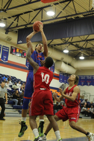 Bishop Gorman’s Chase Jeter (4) goes up for a shot during their scrimmage game against ...