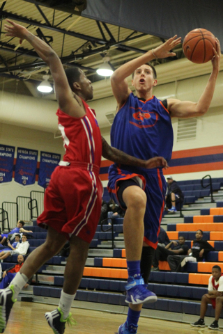 Bishop Gorman’s Zach Collins (12), right, goes up for a shot during their scrimmage ga ...