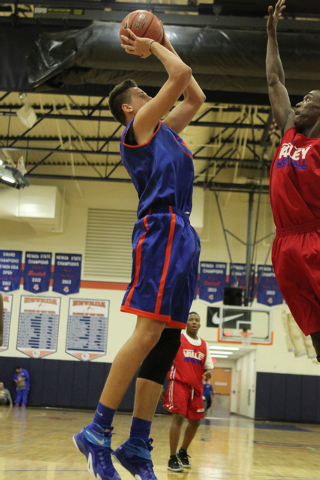 Bishop Gorman’s Zach Collins (12), right, shoots a jumper during a scrimmage against V ...