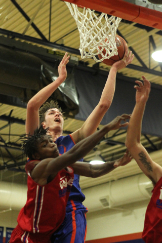 Bishop Gorman’s Stephen Zimmerman (33) goes up for a shot during a scrimmage against V ...