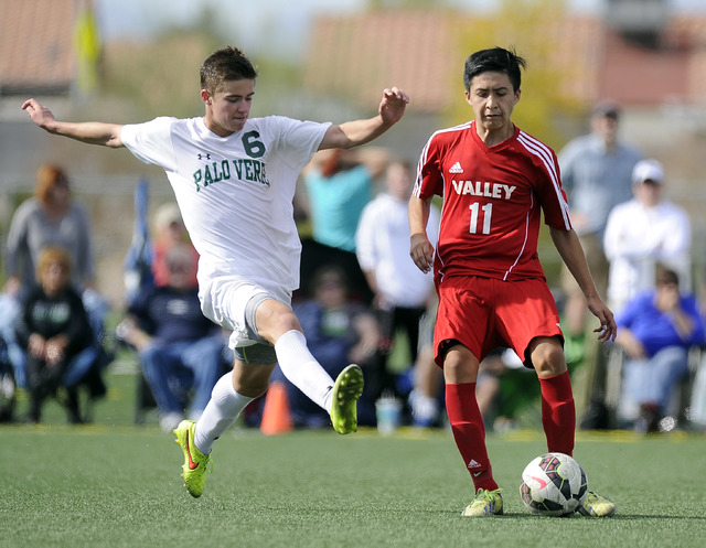 Palo Verde midfielder Connor Ryan (6) tries to block a pass by Valley forward Marco Gonzales ...