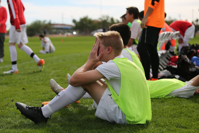 Coronado High School’s Brock Rideout (16) covers his face after losing the the boys Cl ...