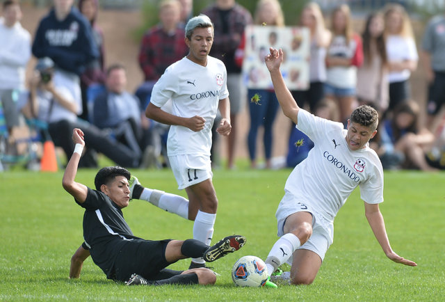 Coronado’s Grant Smyth (3) and Galena’s Francisco Serrano (4) battle for the bal ...