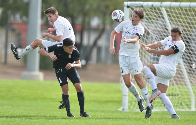Coronado’s Mathew Laudenslager (21) heads the ball during the boys Class 4A State Cham ...