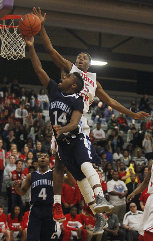 Centennial’s Khalil Thompson (14) gets his shot blocked by Arbor View’s Terrell ...