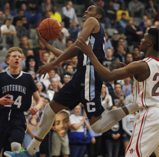 Centennial’s Troy Brown (2) drives past Arbor View’s Justin Burks (25) during th ...