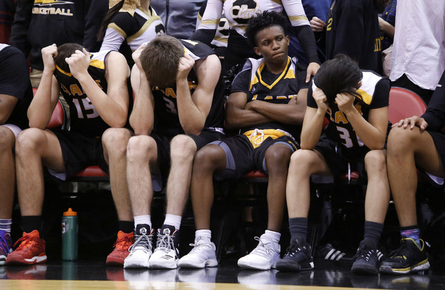 Clark players react after losing to Bishop Gorman in a Class 4A boys state championship fina ...