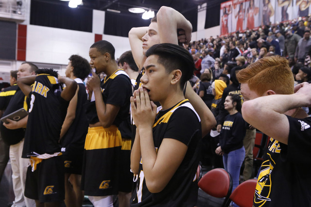 Clark players react after losing to Bishop Gorman in a Class 4A boys state championship fina ...