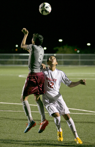 Cimarron-Memorial’s Luis Gallardo, left, and Valley’s Damian Alvarez look for a ...