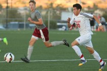 Cimarron-Memorial’s Parker Johnson, left, and Valley’s Eric Sanchez race for rhe ...