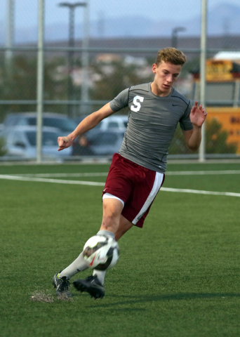 Cimarron-Memorial’s Parker Johnson kicks the ball during the Division 1 boys state soc ...