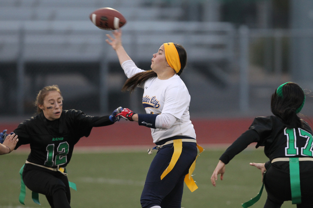 Boulder City quarterback Jeanne Carmell (14), center, throws a pass during their flag footba ...