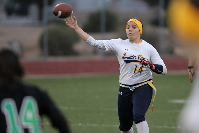 Boulder City quarterback Jeanne Carmell (14) throws a pass during their flag football game a ...