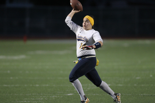 Boulder City quarterback Jeanne Carmell (14) throws a pass for an extra point during their f ...