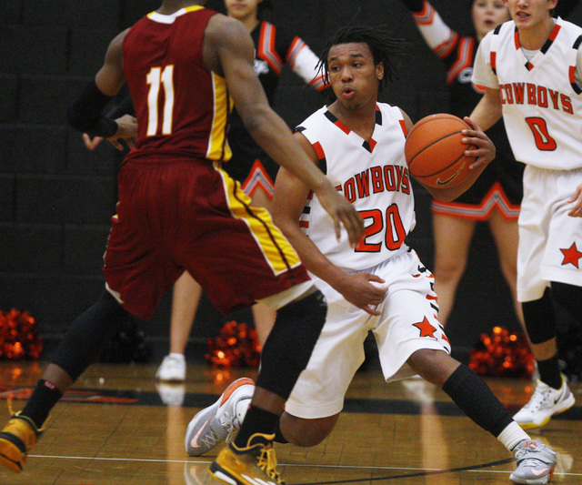Chaparral forward Richard Nelson switches direction while being defended by Del Sol forward ...