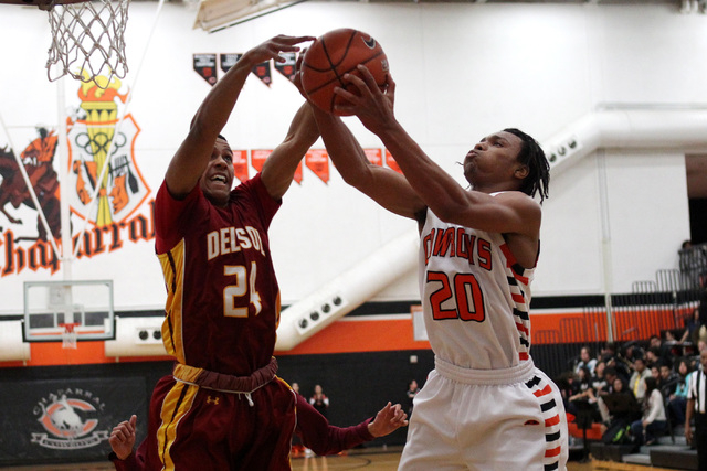 Chaparral forward Richard Nelson grabs a rebound from Del Sol forward Ganny Belloni on Thurs ...