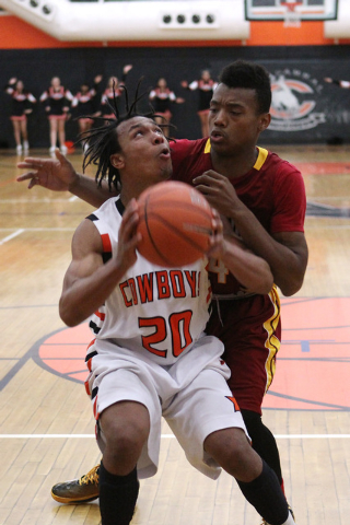 Chaparral forward Richard Nelson looks to the basket while being defended by Del Sol forward ...