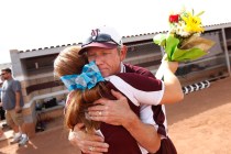 Cimarron-Memorial softball coach Steve Gorden hugs player Michelle Knott during a ceremony h ...
