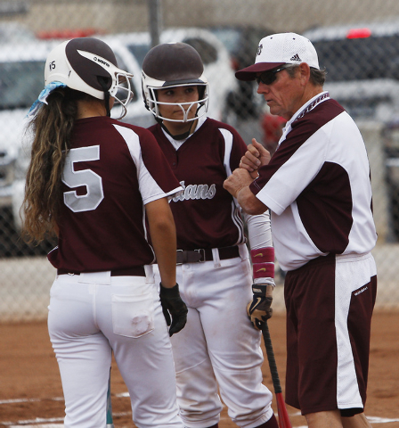 Cimarron-Memorial softball coach Steve Gorden offers some hitting advice to players Rosie De ...