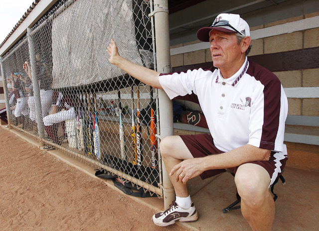Cimarron-Memorial softball coach Steve Gorden signals for a defensive adjustment during thei ...