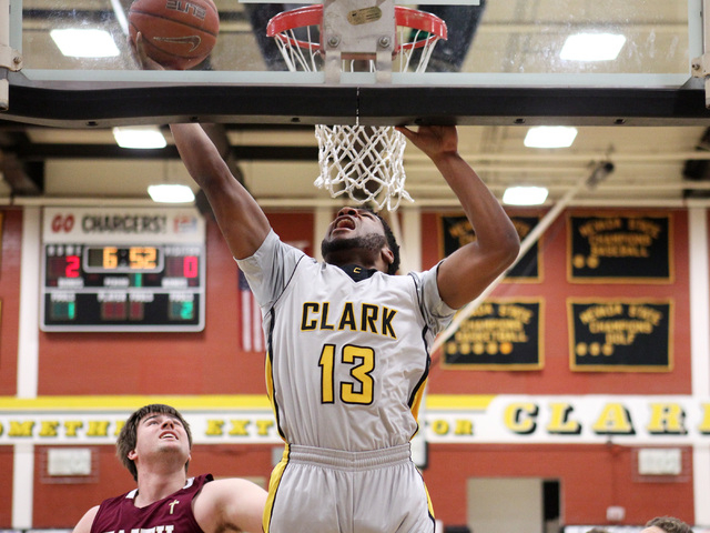 Clark forward Ty’Rek Wells drops in two points on Faith Lutheran during their game Thu ...