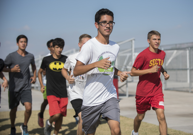 Junior Bruce Troncoso, center, 16, runs during cross country practice at Southeast Career Te ...