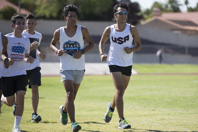 Green Valley cross country runner Lenny Rubi, 17, right, runs during a team practice at Gree ...