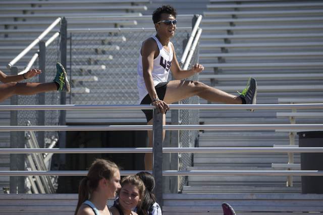 Green Valley cross country runner Lenny Rubi, 17, leads a stretch during a team practice at ...