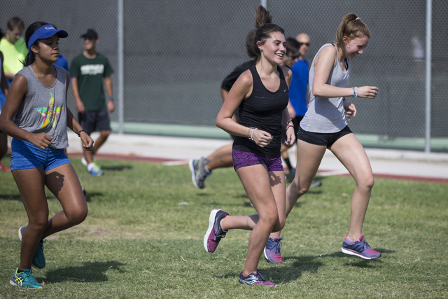 Green Valley cross country runner Mia Smith, 15, center, runs during a team practice at Gree ...