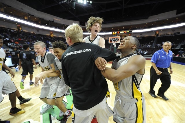 Clark players celebrate their 62-46 win over Desert Pines during the Division I-A boys state ...