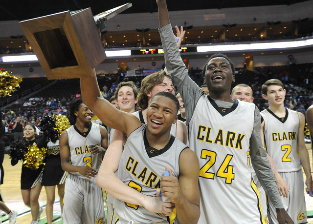 Clark players celebrate their 62-46 win over Desert Pines with the Division I-A state champi ...