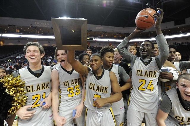 Clark players celebrate their 62-46 win over Desert Pines with the Division I-A state champi ...