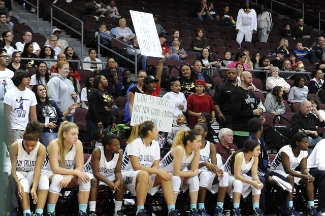 A Spring Valley fan holds up a sign during Division I-A girls state championship game at the ...