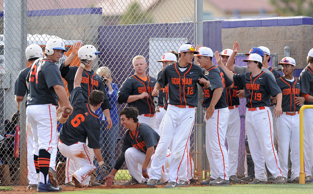 Bishop Gorman players high five Beau Capanna (6) after he hit a two-run home run against Arb ...