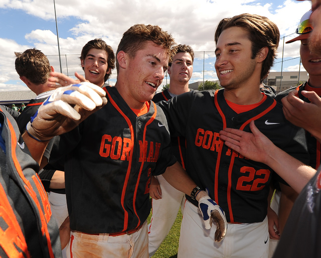 Bishop Gorman players celebrate with Cadyn Grenier, left, after he hit a walk-off home run i ...