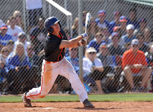 Bishop Gorman shortstop Cadyn Grenier (2) hits a walk-off home run against Green Valley in t ...