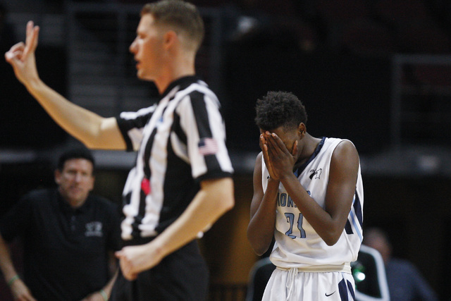 Canyon Springs guard D’Quan Crockett reacts after being called for his fifth foul agai ...