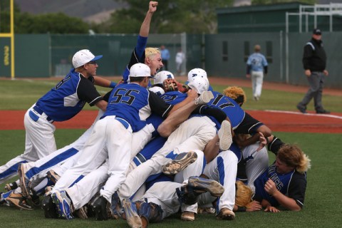 The Basic Wolves celebrate their 9-1 win over Centennial for the NIAA DI baseball championsh ...