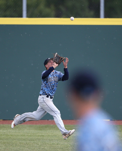 Centennial’s Austin Kryszcuk makes a catch against Basic in the NIAA DI baseball cham ...