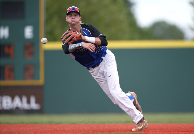 Basic’s Ryne Nelson makes a play against Centenniall in the NIAA DI baseball champion ...