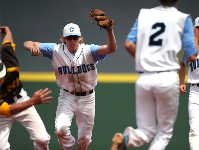 Centennial’s Jake Rogers chases down Galena’s Nate King during NIAA DI baseball ...